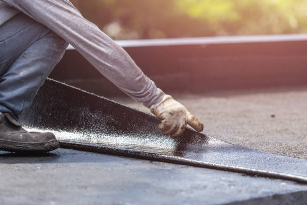 Professional Basement Waterproofing technician working in Fultonham, OH